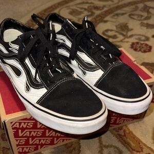 Vans  Lace up  Black & White Flames.  Great slightly used
Women’s 9.5  Men’s 8